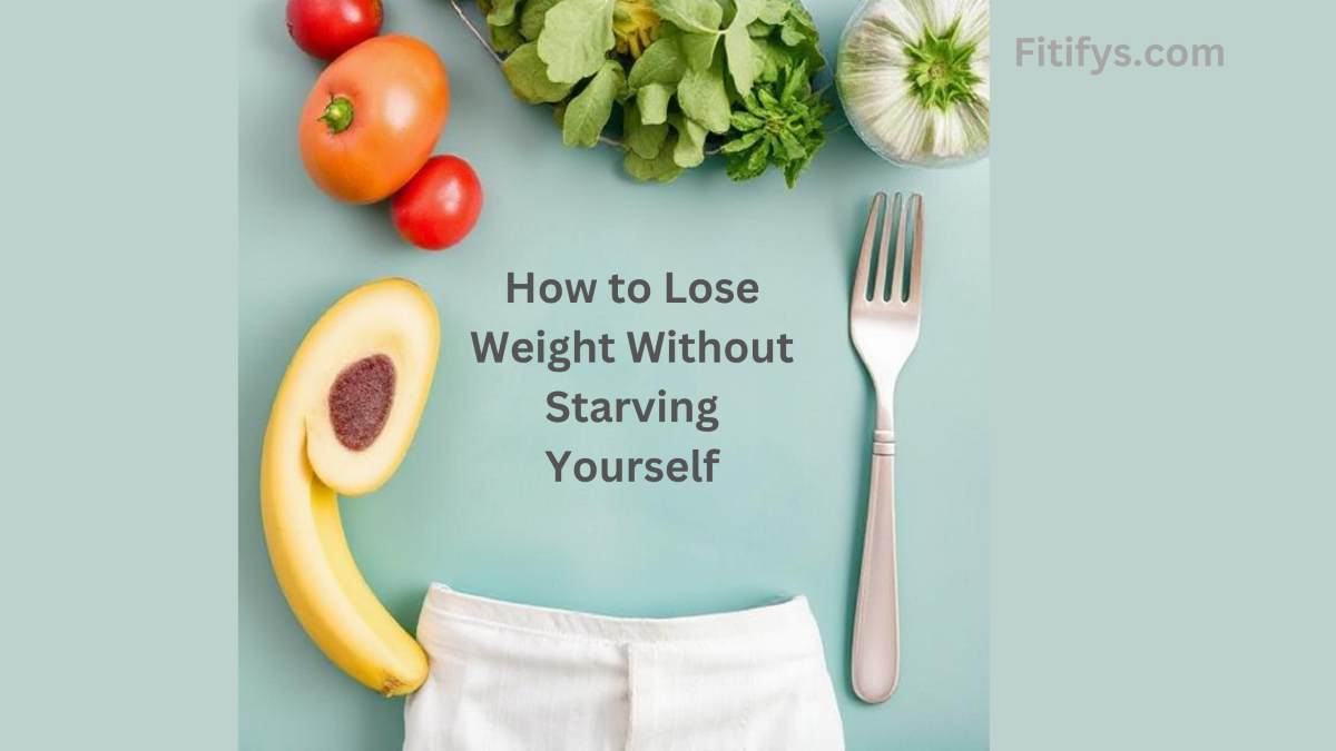 A creative flat lay image with a banana and a pair of white pants arranged to resemble a waistline, paired with a fork and fresh vegetables including tomatoes, lettuce, and garlic on a light blue background. Text in the center reads: “How to Lose Weight Without Starving Yourself,” and the image is branded with “Fitifys.com” in the corner.