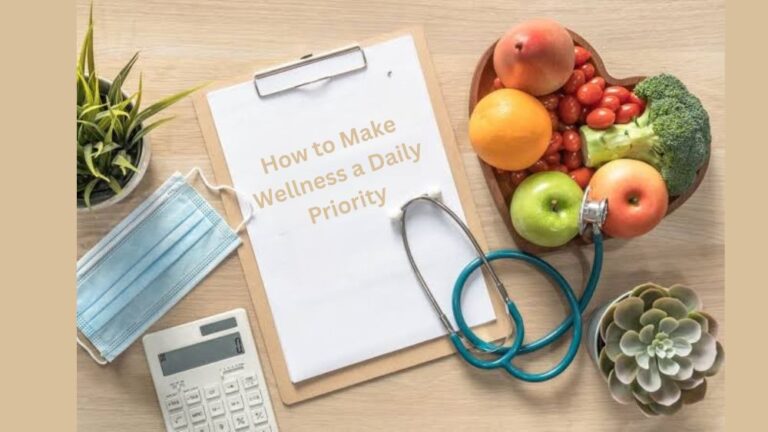 A flat lay of wellness essentials on a wooden table, including a clipboard with the text “How to Make Wellness a Daily Priority,” a stethoscope, a face mask, a calculator, a heart-shaped bowl filled with fresh fruits and vegetables, and small plants—symbolizing health, balance, and self-care.